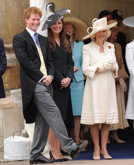 Kate Middleton black hat is shown with Prince Harry of Wales and Camilla 
