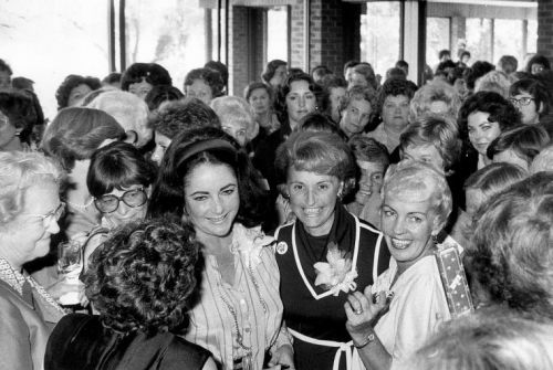 Twelve days before the U.S. Senate election,Republican women crowd around Elizabeth Taylor Warner at the Meadowbrook Country Club, Richmond. Va.  Oct. 26, 1978.